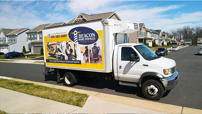 Truckside Ads for Beacon Home Services in a residential neighbourhood.