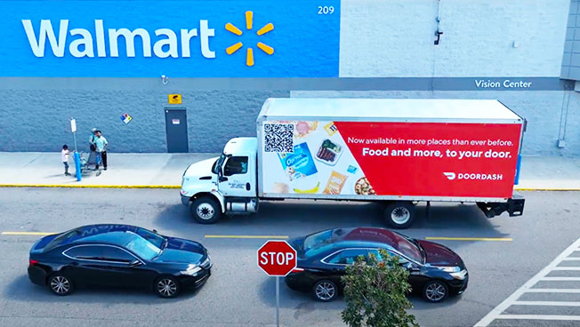 Mobile Billboard advertisement for DoorDash out front of a Walmart Store