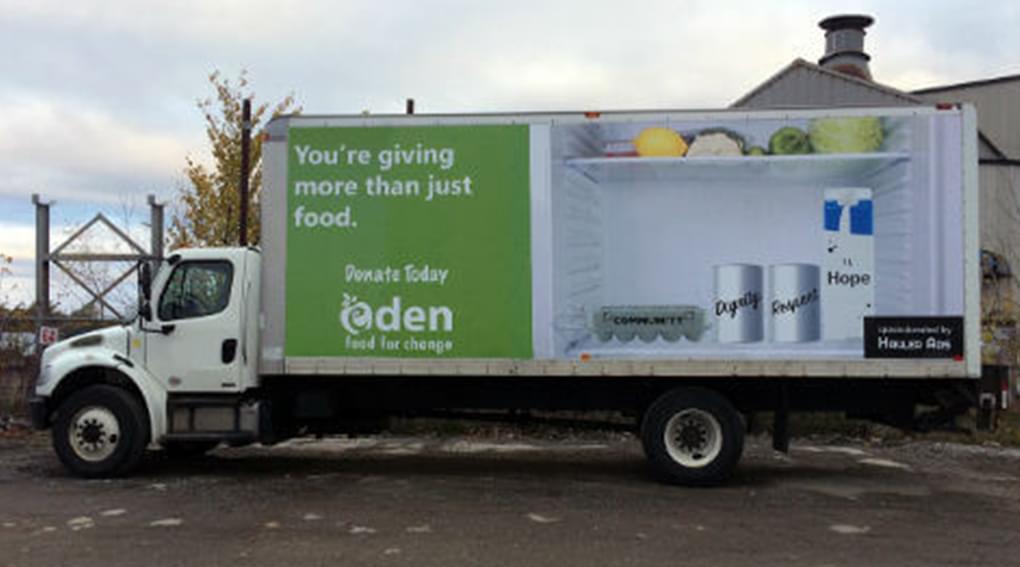 Truckside Advertisement photo of Eden Food Bank showing casing a fridge that could be filled up