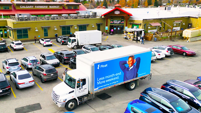 Truckside Ads for Float in a Farmers Market Parking Lot