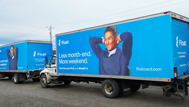 Truckside Ads for Float in a Calgary Parking Lot