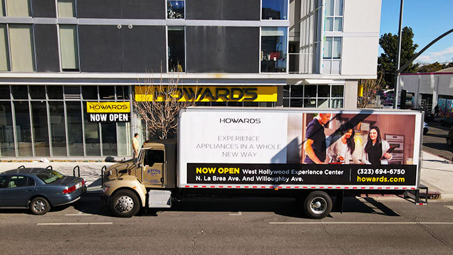 Truck Advertisement photo of Howards doing a targeted business area OOH advertising campaign