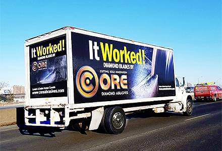 mobile billboard driving on the highway advertising for Core Diamond Abrasives.