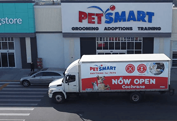 Mobile billboard advertisement for Petsmart on side of truck