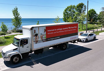 Mobile billboard advertisement for Rogers on side of truck