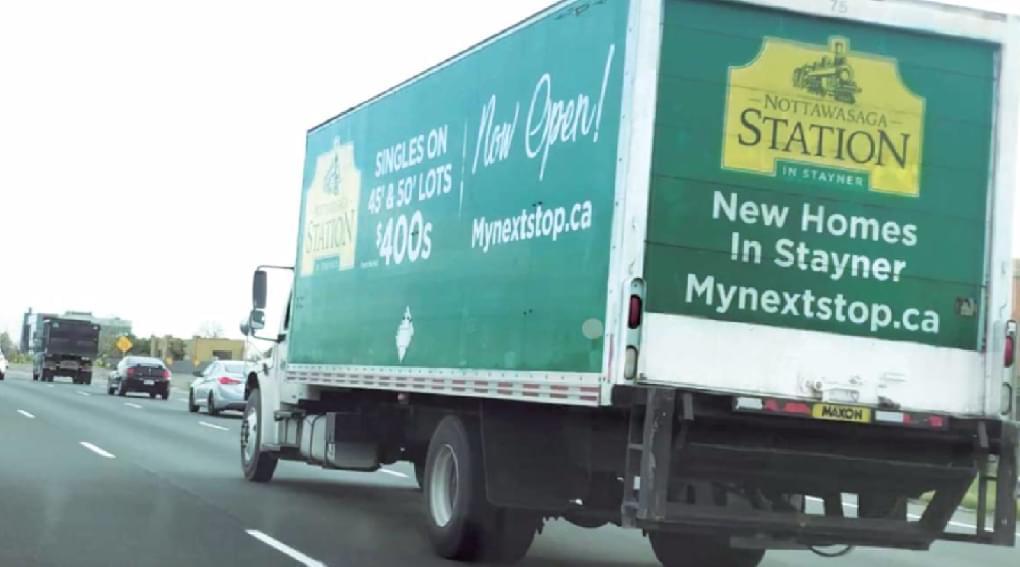 One Truckside Advertisements for MacPherson Home Builders on the highway in Toronto