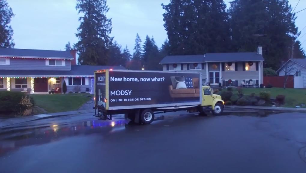 Truckside Advertisement photo of Modsy doing a targeted residential OOH advertising campaign