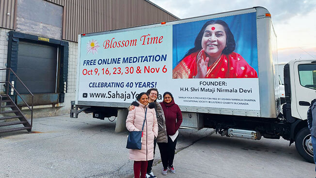 Photo of Vishwa Nirmala Dharma doing a targeted Truckside Ad campaign