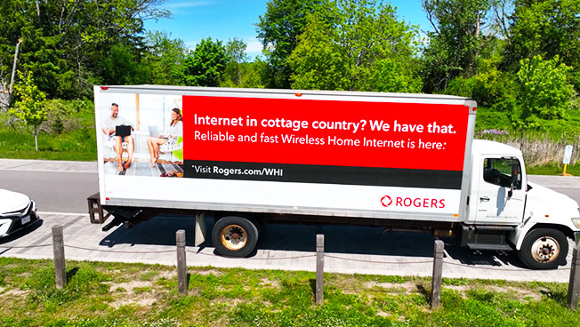 Truck Advertisement photo of Rogers doing a targeted business area OOH advertising campaign