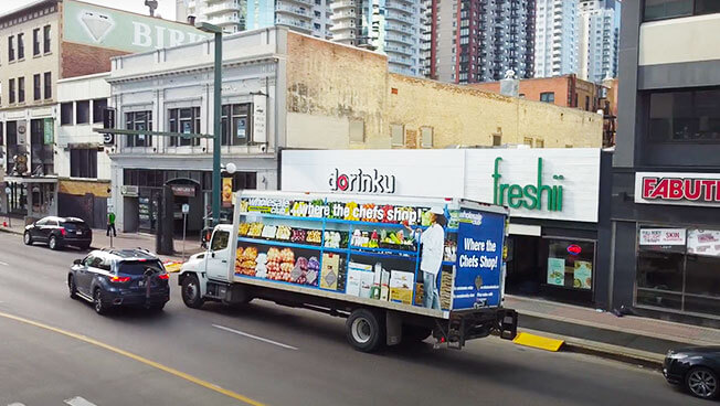 Truckside Advertisement photo of The Wholesale Club doing a targeted business area OOH advertising campaign