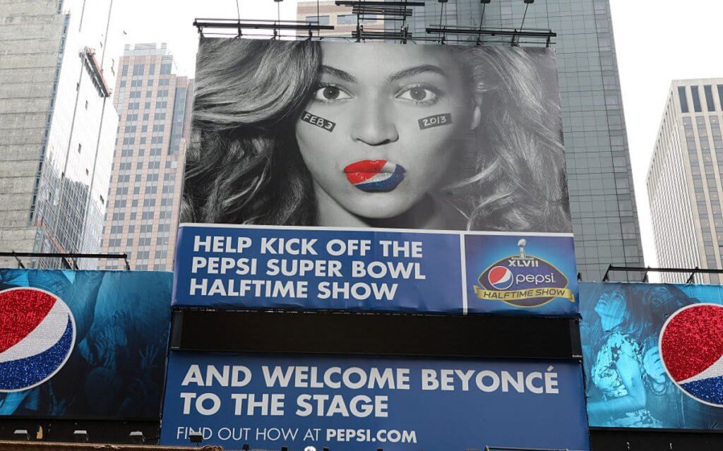 A giant billboard ad for the Super Bowl with Beyonce pursing her lips with the Pepsi colours on them. 