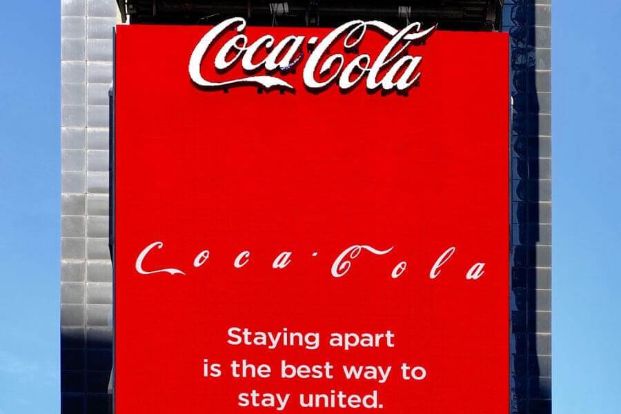 Coca-cola billboard with letters in logo being spaced out.