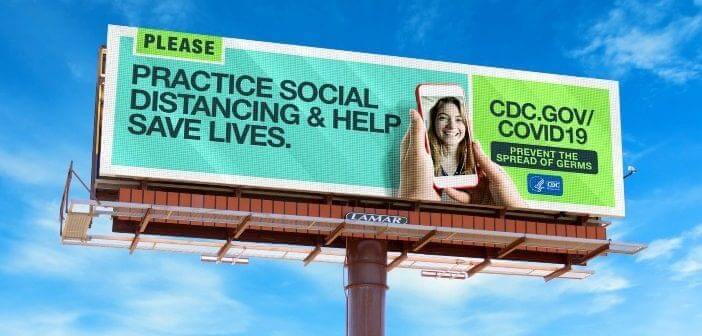 An image of a billboard that says, "Practice social distancing & help save lives." It's a PSA from the CDC and is bright turquoise and green. 