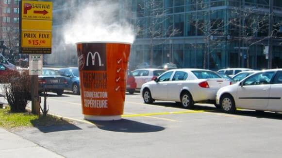 An outdoor guerrilla marketing execution elicits surprise in people just happening to be there