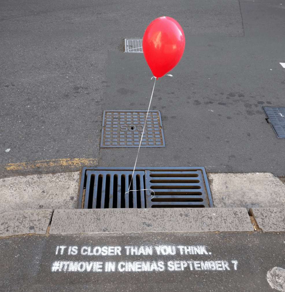 This guerrilla ad sparks curiosity in people passing by with its alluring big, red balloon