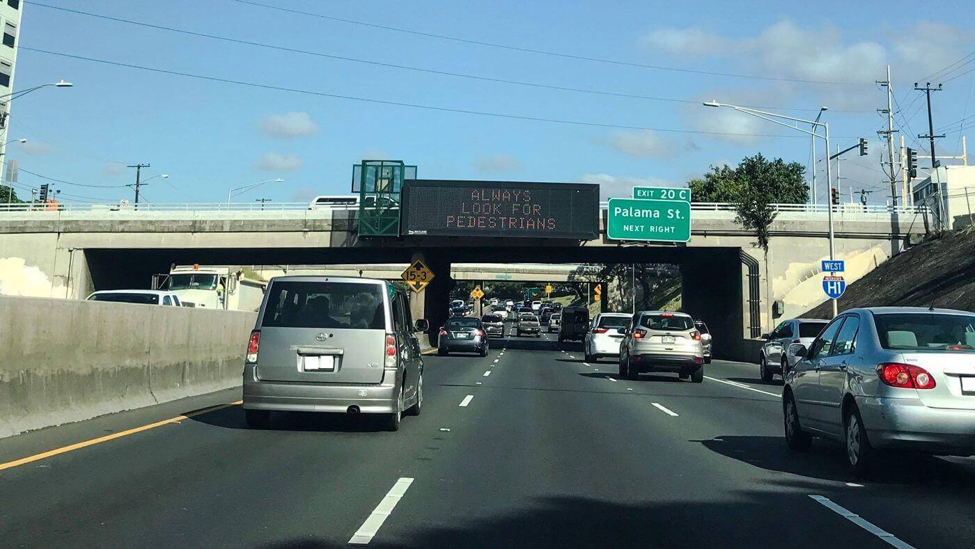 Hawaii is holding up a shaka to billboards