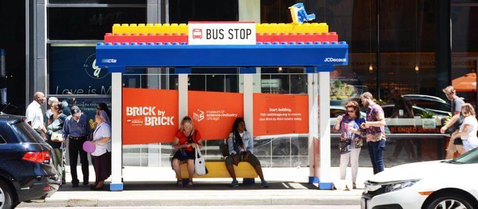 This bus stop furniture ad encourages people to take a seat while exploring the brand
