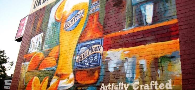 A Blue Moon advertisement in Boston is hand painted on the side of a building to promote both the brand and the artistry
