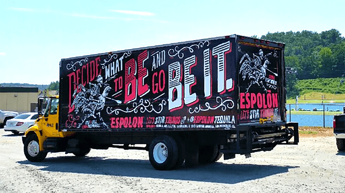 Brand awareness takes the form of bright graphics presented on this truckside ad