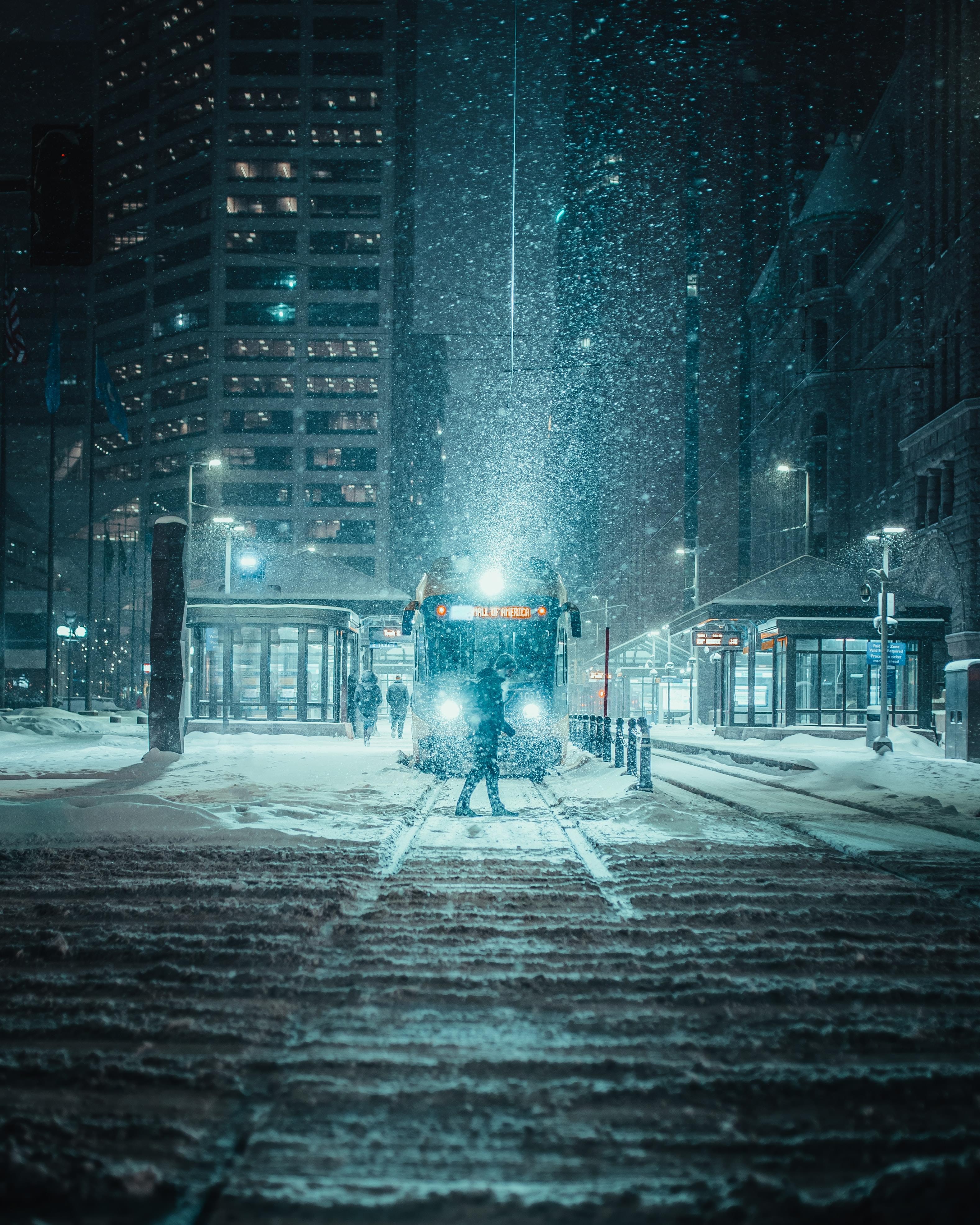 Person Standing in front of a Train in the wintertime
