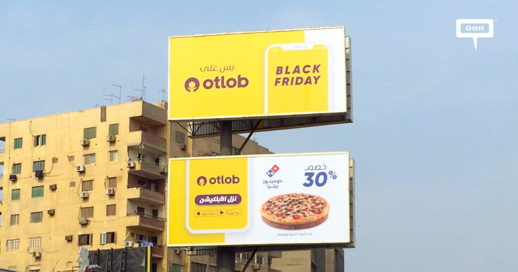 An image of two billboards promoting a Black Friday sale for Domino's pizza.