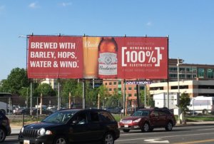 Budweiser's OOH billboard. It reads, ' Brewed With Barley, Hops, Water & Wind.'