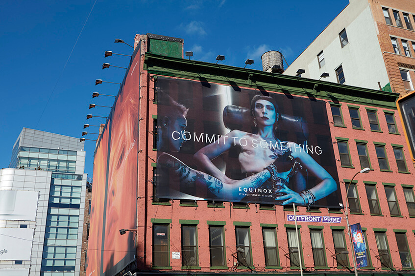 Equinox's "Commit to Something" Campaign billboard of a woman after a double mastectomy.