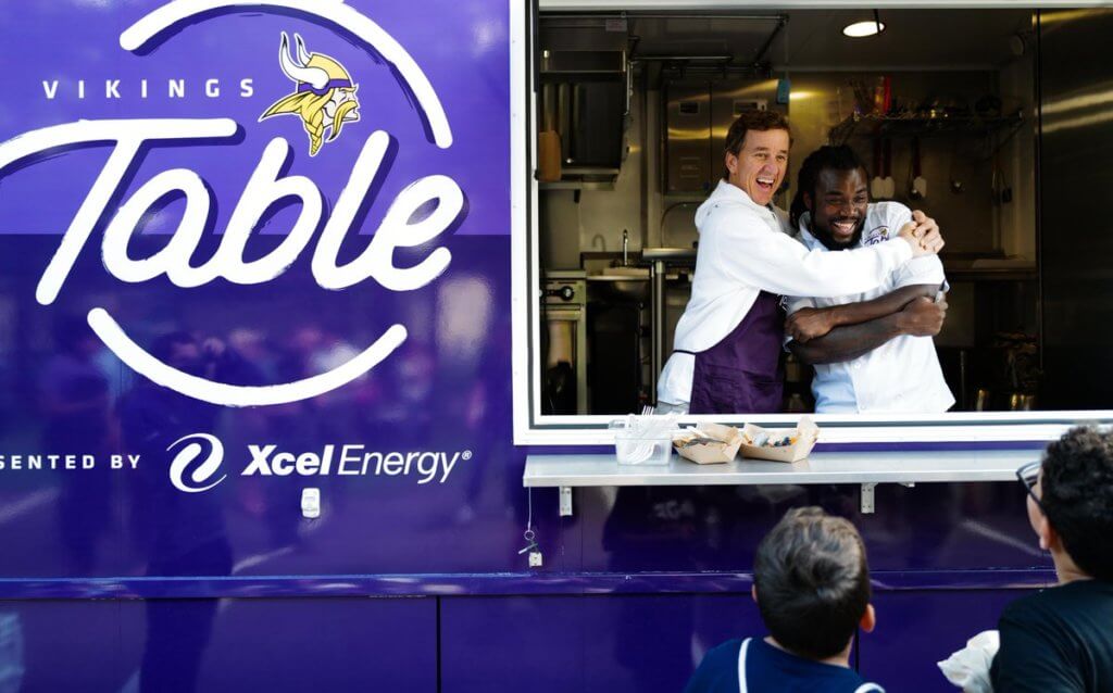 An image of a food truck with emphasis on the ad on the side of the truck for Vikings Table. 