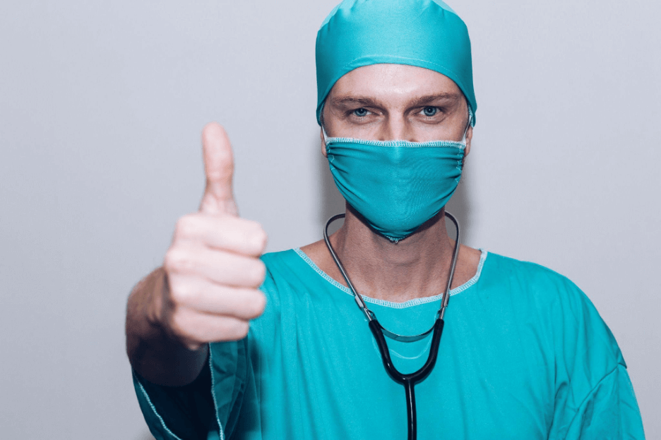 Healthcare professional giving a thumbs up