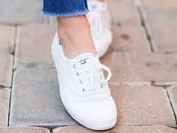 Keds white shoe modeled.