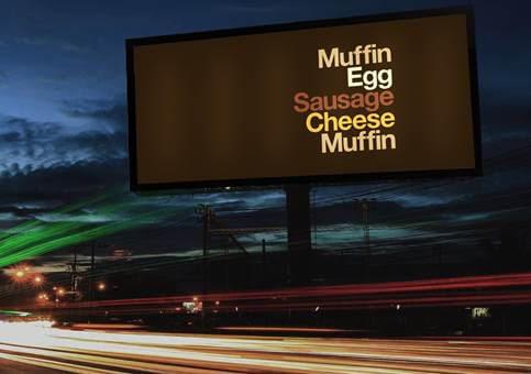 Image of McDonald's OOH billboard advertising their Breakfast English Muffin. Ad says ingredients of the sandwich, "Muffin, Egg, Sausage, Cheese, Muffin" and does not show any McDonald's branding.