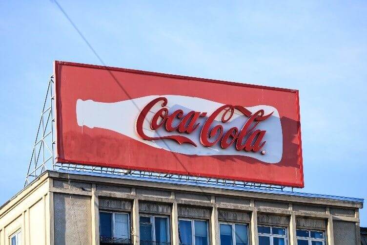 Faded Coca-cola billboard.