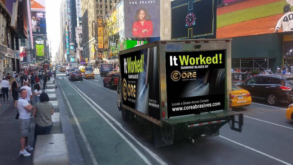 A truck wrap for Core Abrasives driving on busy downtown Toronto street.