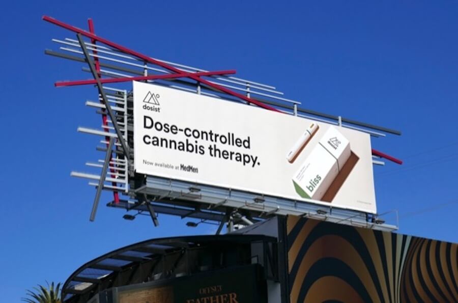 A billboard ad for Dosist with its packaging and the capsule.