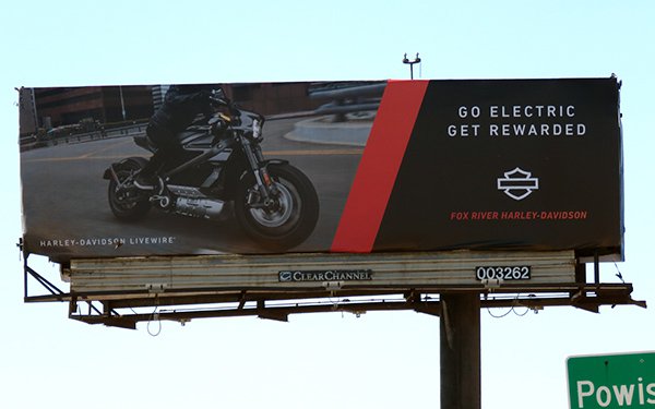 An image of a billboard for Harley-Davidson featuring a man on a motorcycle.