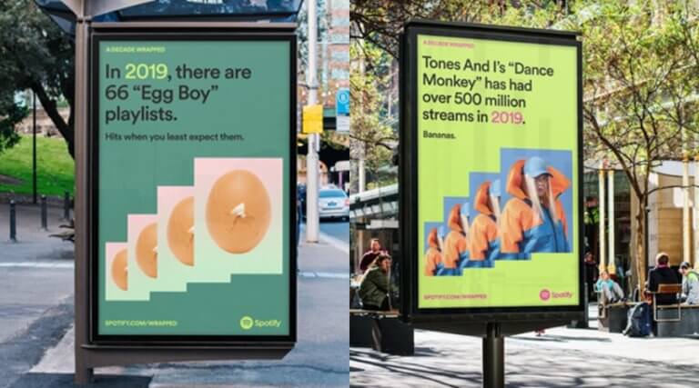 Two Spotify Wrapped billboards, one saying "In 2019, there are 66 egg boy playlists. Hits when you least expect them" and the other saying "Tones and I's Dance Monkey has had over 500 million streams in 2019. Bananas.".