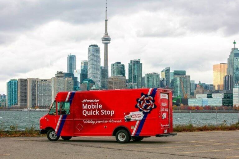 Purolator's new Mobile Quick Stop service truck with the city of Toronto in the background.