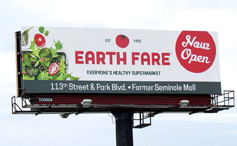 An image of a billboard for a supermarket called Earth Fare with a salad on it.