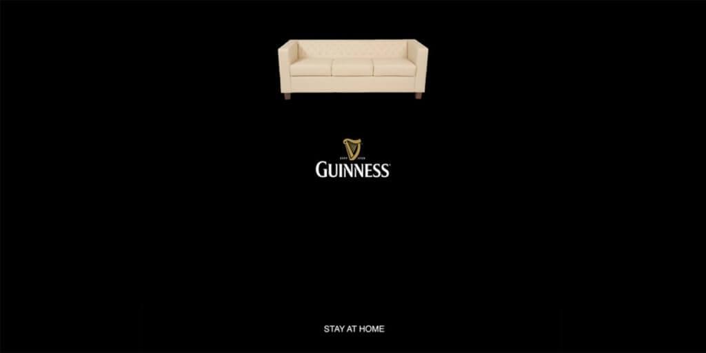 An image of a Guinness advertisement. The image is a glass of Guinness but instead of foam on top, there's an image of a couch. at the bottom it says "stay at home". 