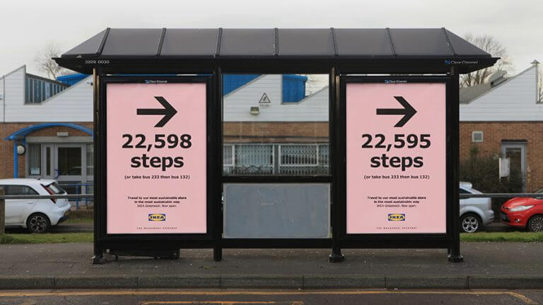 An image of a bus-stop ad for IKEA. the background is pink and has arrows pointing to the right. 