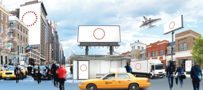 An image of a busy street with different possible placements for ads. A side of a building, a billboard, a bus-stop, a truck, the top of a taxi cab.