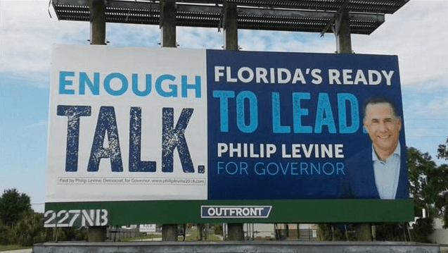 An image of a billboard that reads, "Enough talk. Florida's ready to lead Philip Levine for governor". With a picture of Philip beside it.