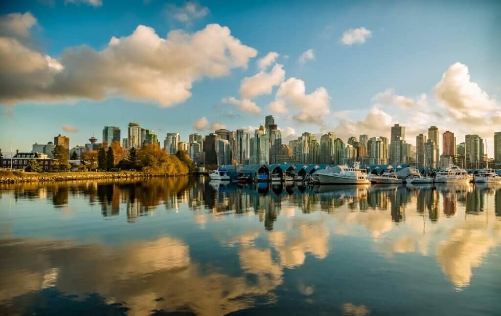 Landscape of the city of Vancouver reflecting over a body of water.