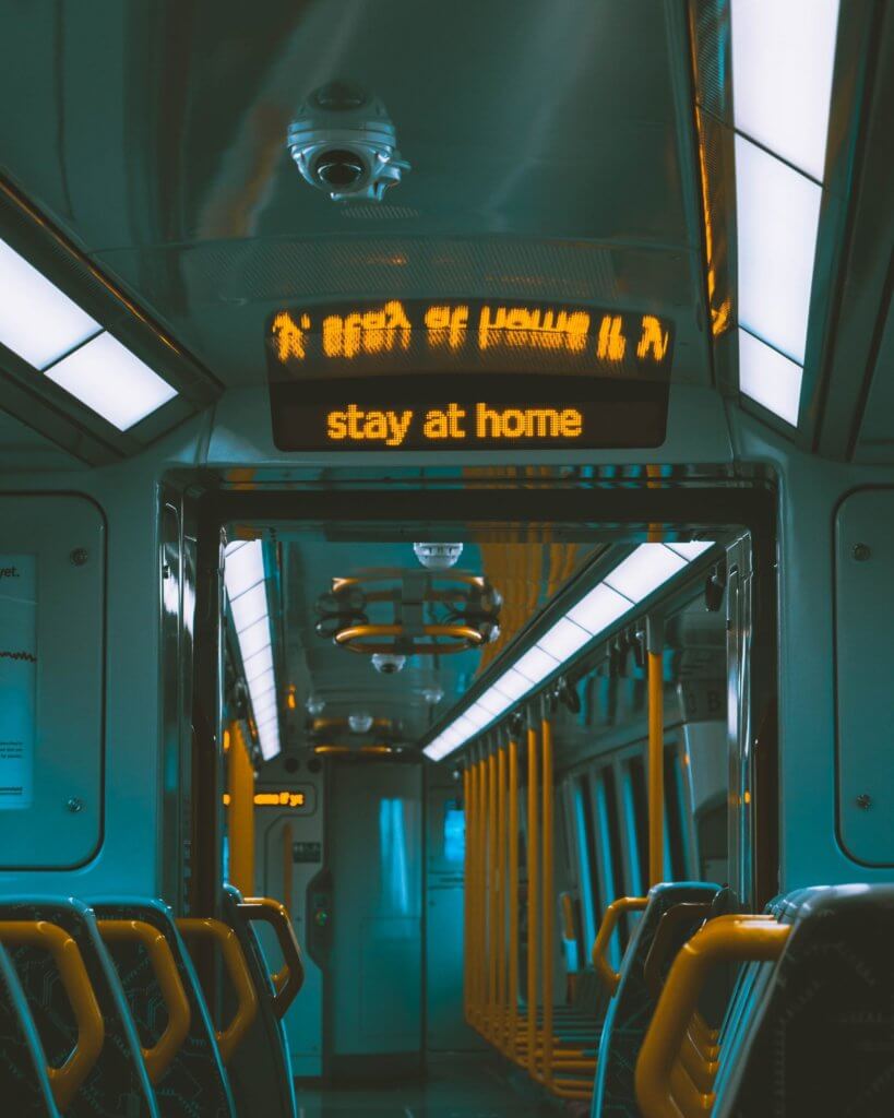 A digital sign in the metro that reads" Stay at home".
