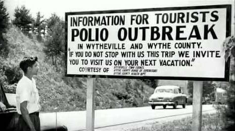 An old billboard warning the public about the Polio outbreak.