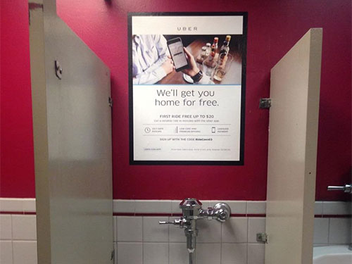 An OOH advertisement in restrooms.