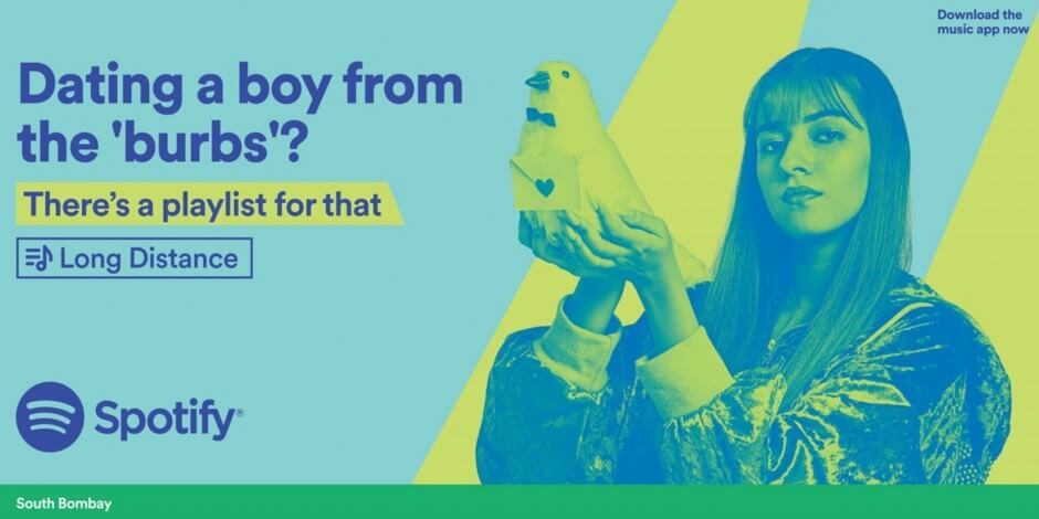 An image of an advertisement for Spotify and their famous wrapped campaign. Has an image of a girl holding up a bird with a love letter.