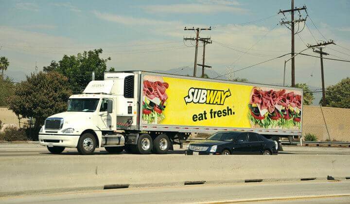 Image of mobile billboard advertising Subway sandwiches. Ad says "eat fresh."