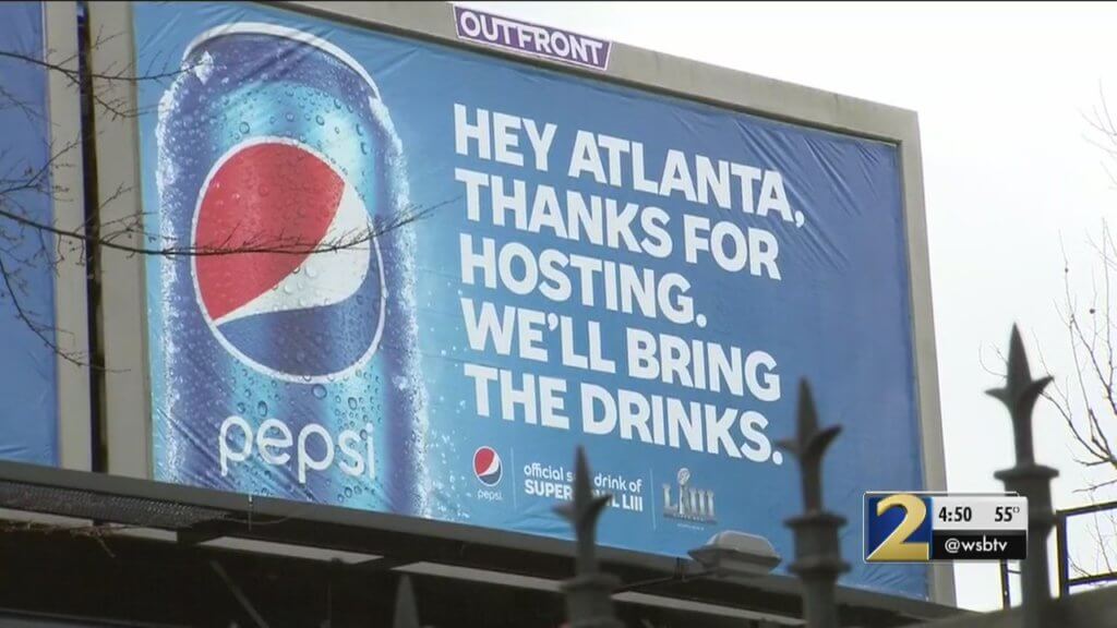 An image of a Super Bowl billboard ad by Pepsi. Poking fun at Coca-Cola.
