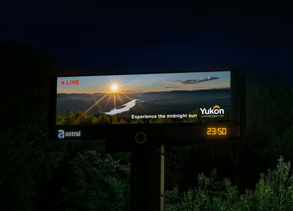 Tourism Yukon attracted tourists through digital billboard showcasing the beautiful view of the midnight sun in Dawson City